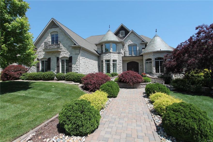 One of St. Charles most prestigious homes w/all brick & stone elevation, slate turrets & over 8400 sq ft of finished living space. High end finishes include: complete lighting automation, Sonos/Elan sound system, Sub-Zero, Dacor, & Kitchen Aide appliances, custom paint, & millwork. Main floor master w/luxury bath, mirror reveal TV, walk-in closet w/custom organizers, & private balcony. Library/den, organization center, built-in cubbies, gourmet kitchen, living rm, dining rm w/butler pantry, & hearth rm w/see thru fireplace finish the 1rst floor. Upper level includes 5 generous sized bedrms, 1 on-suite bath, & 2 Jack & Jill baths. The w/o LL features full kitchenette/bar, family rm, see thru fireplace, rec rm, fitness rm, pool/locker rm, & 1500 bottle wine cellar w/tasting rm. The backyard is a private oasis w/gunite pool, sheer descent waterfall & fountains, decks, patio, gazebo, sound system, fireplace, & built in gas grill. Garage includes tek wall organizer & epoxy quartz flooring.