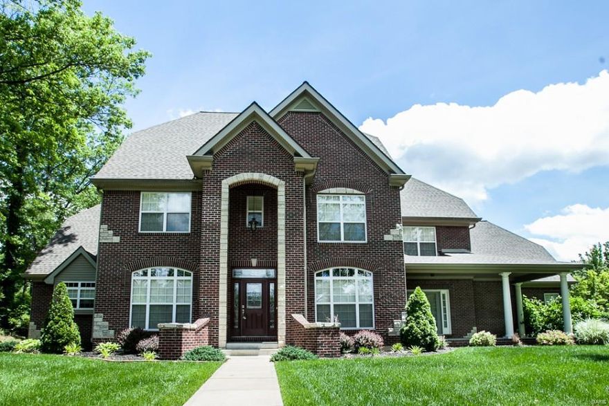 Beautiful 1.5 Story that is 4 Yrs old featuring 4Car O/S Garage, 5 Beds, 4.5 Bths, Prof Fin LL & backs to trees; O/S Foyer w/Leaded Glass Frt Door; Kit features Cherry Hdw Floors, Custom Cherry Blt in Cabinets, Granite Counter tops, Breakfast Bar, Stainless Steel Appliances, Center Island w/Gas Stove Cook top; Breakfast Rm has Hdw Flooring , Wall of Windows overlooking Treed Backyard, Ceiling Fans, Gas F/P & Canned Lighting; Separate DR w/Hdw Flooring,  Office/Den has French Doors; Master Bed has French Doors leading out to Covered Frt Porch, Tray Coffered Ceiling, Crown Molding, Canned Lighting, Ceiling Fan; Master Bth features His & Her Closets, stone flooring, Granite Counter Tops, Jacuzzi jet tub for relaxing; Upper Level features Loft, 3 Beds, 2 Fl Baths (Jack & Jill); Prof Fin LL features Exercise Rm, Media Rm, Bedroom, F/P, In-Law Quarters, Bar w/Granite

Low maintenance yard, if your looking for a large yard this isn't the lot for you, the home is fantastic. Additional Rooms: Mud Room