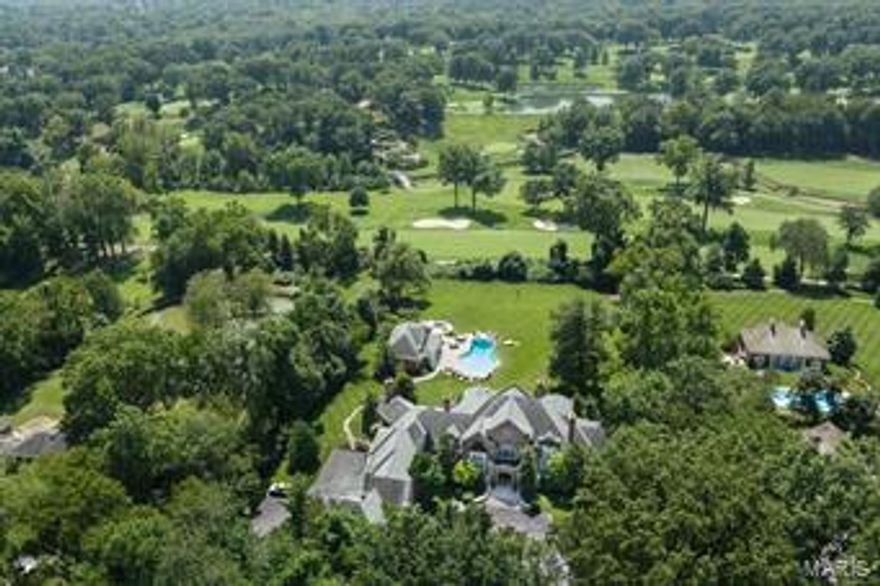 This majestic French Country property on 3+ acres is tucked out of sight, yet offers a breathtaking panoramic view from the back over its grounds, pool, amazing pool house, and the Old Warson Golf Course.  The interior features every amenity including smart technology, elevator, 6 fireplaces, dumb waiter, and an incredible 7,000 bottle wine cellar with tasting room in the fully finished lower level. Main floor has 10 ft ceilings, 8 and 9 foot doorways, & exquisite millwork.  Open floor plan creates good flow for entertaining & very comfortable, surprisingly casual living. Exceptional main floor master w/ multiple walk-in closets, luxurious bath w/ steam shower. Tuscan inspired cook’s kitchen is open to informal dining area & large welcoming family rm w/ 17th century limestone fireplace & wet bar. 2nd floor overlooks foyer & has 3 bedroom suites, a large bonus room, deck & laundry. Front and back stairs. Sun Room. Screen porch. Dog rm w/lg doggie door. Two 2 car garages. One of a kind! Additional Rooms: Sun Room