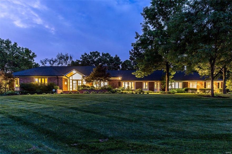 Elegant home in one of Ladue’s finest neighborhoods! Situated on 3 acres with beautifully landscaped gardens and a private, welcoming salt water pool. Inside find soaring ceilings & well thought out details. The kitchen has been completely upgraded for comfort, convenience & sophistication. Some features include rare, hand selected Brazilian Azul Macaubus quartzite counters on several surfaces, new appliances & elegant mother of pearl back splash. All of these details carry into the wet bar in the family rm, which also features one of 3 fireplaces. The master suite is an oasis w/expansive closet space, sitting area, spa-like bath & direct access to the patio & pool area. Find a 2nd master suite at the opposite end of home. The w/out LL is complete w/full kitchen, rec rm & guest suite. Enjoy fabulous evenings & lazy days in the beautifully landscaped private backyard including a cozy firepit. Priced below appraisal....