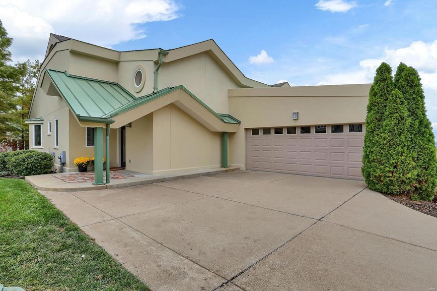 Custom built development, this end unit villa is beautifully landscaped. Rare opportunity to find a property that sides to common ground and gives feeling of privacy. Enjoy carefree living all on one level in uniquely designed complex in convenient location. Handsome property with quality construction, luxurious finishes & light filled rooms with open spaces. Kitchen offers custom cabinetry, flamed granite, designer appliances, center island and room perfect for family gatherings or casual dining. Vaulted ceilings, gas fireplace, book shelves, hardwood floors in the expansive great room provide perfect spot for gathering. Spacious master suite with coffered ceiling & ample closet space. The 2nd bedroom has en-suite bath & large walk-in closet; all closets customized by St. Louis Closets. Walkout to tranquil patio for coffee or cocktails & feel relaxed. Oversized 2 car attached garage w/wall of storage, guest parking, first floor laundry/mudroom. Location: End Unit, Ground Level