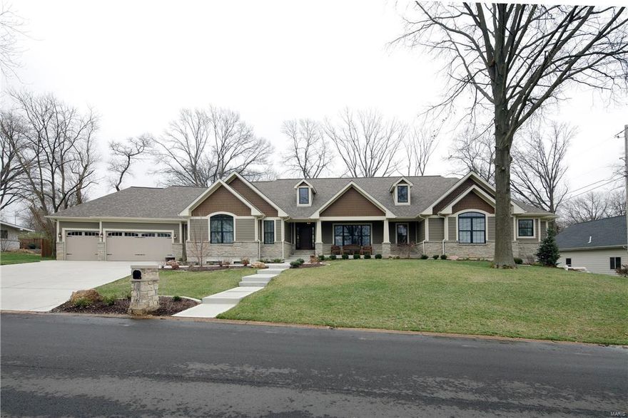 Outstanding Custom Ranch Home constructed by The Kelly Company is Situated on a Wonderful Level Homesite in Sought after Harwood Hills. An OPEN*SPACIOUS*Ranch offers 3600sqft on Main Floor + 2000 sq ft Finish in Lower Level. Gorgeous Home offers Beautiful Flooring, Custom Doors, Stone Fireplace, Custom Baths, Arches, Rounded Corners, Knockdown Drywall Finish and a Gorgeous Master Suite plus 2 Spacious ML Bedrooms. Unique Custom Feature is the Private 4th Bedroom Suite. This Custom Kitchen w/Ample Center Island serves the Sophisticated Chef. The Custom LL offers a 9'Pour + Floor Truss allows NO Columns in the Finished Lower Level. LL includes: a Movie Theater, Bar, Game Room w/Pool Table, 2 Bedrooms + Bath. An Open Oak Staircase leads from the 1st to the LL. See this Spectacular Outdoor Entertainment Center. A Low Deck leads to the Level Fenced Yard featuring a 20 x 20 Pergola w/60"Gas Grill and Fireplace, The Egg and a Sink and a Must See manmade Creek w/lovely walk over  Bridge COOL: 14 SEER+