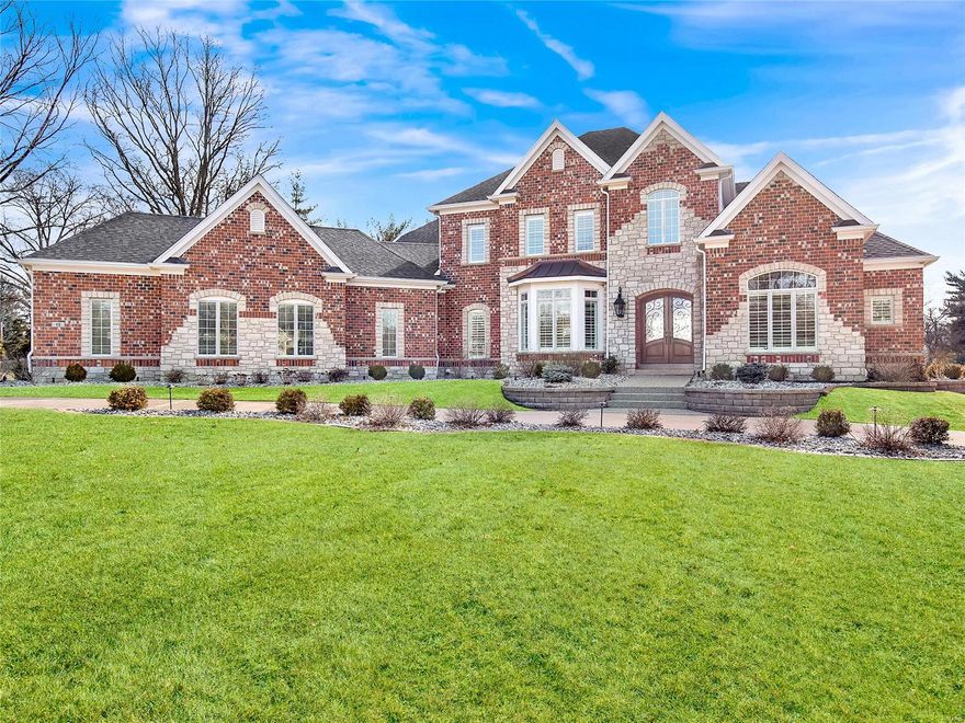 This resplendent "four years new" 1.5 story custom built Town & Country manor home rests majestically on this quiet & private one plus acre lot. The glorious all brick & stone construction, exquisite cabinetry, millwork, timeless elegance & meticulous attention to detail are hallmarks of a residence built to be both impressive & luxurious. Once entering the gala sized entry & viewing the sparkling hardwood floors, you will be blown away! Grand main floor master suite! The kitchen & butler’s pantry are stunning spaces filled with designer touches, both offering a superb enhancement for entertaining & family living. High ceilings extend everywhere on all 3 levels incl the walkout lower level with custom bartender’s bar & seating, bright workout space, bdrm & full bath. Everyone will love the recently finished covered patio with fireplace & adjacent open air seating area. Four bay garage. Convenient location for hospitals & highways, yet secluded for even the most discriminating buyer!