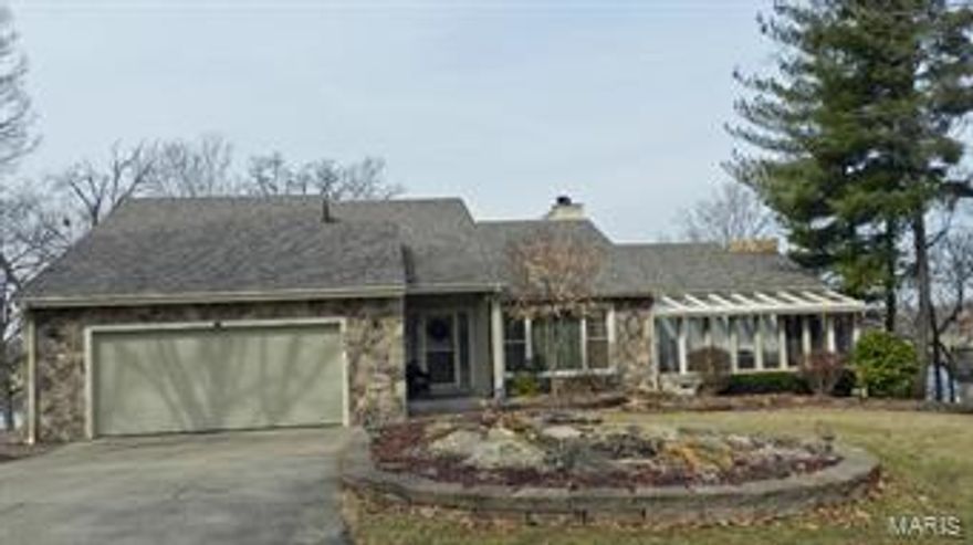 One party listing to be used for comparable purposes only. Large lake waterfront with wonderful views from wooded lot. Many updates including roof, updated kitchen with solid surface countertops and stainless steel appliances, flooring, windows, deck, seawall and retaining wall system, steps to lake. Dock and hydrohoist lift included.