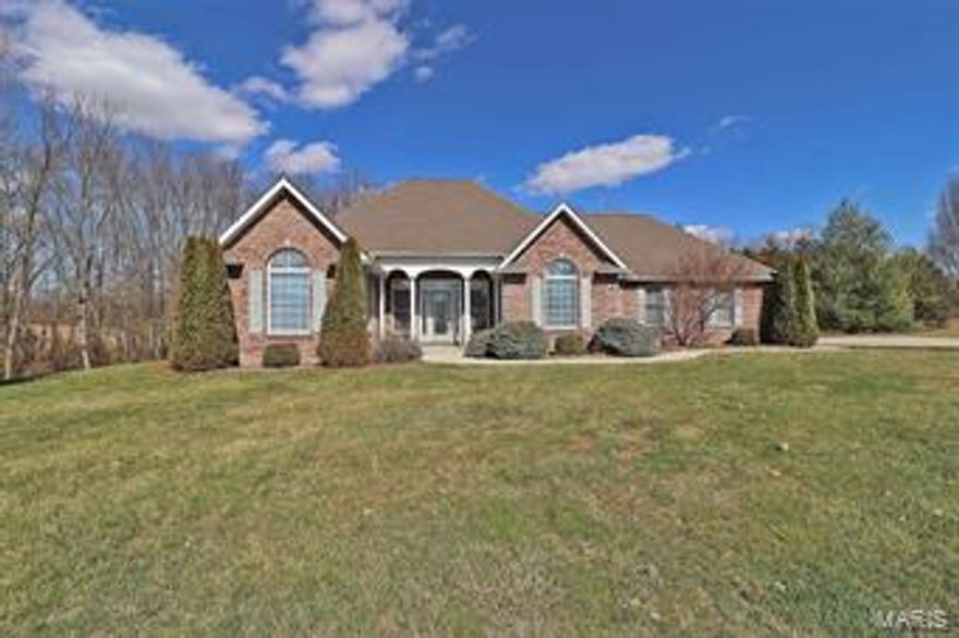 Extraordinary location!  Close to town but out of the city.  More than 2800 sq ft on the main level, with partially finished walk-out basement on 3 acres.  Gorgeous setting on a cul-de-sac in Stone Creek Subdivision.  Big deck and patio.  3 Bedrooms, 3.5 baths, gas fireplace, breakfast room, formal dining room, vaulted ceilings and walls of windows. Kitchen features lots of cabinetry, pantry, large island with sink, electric cook top and double oven.  2 HVAC units and 2 water heaters. Elegant home.