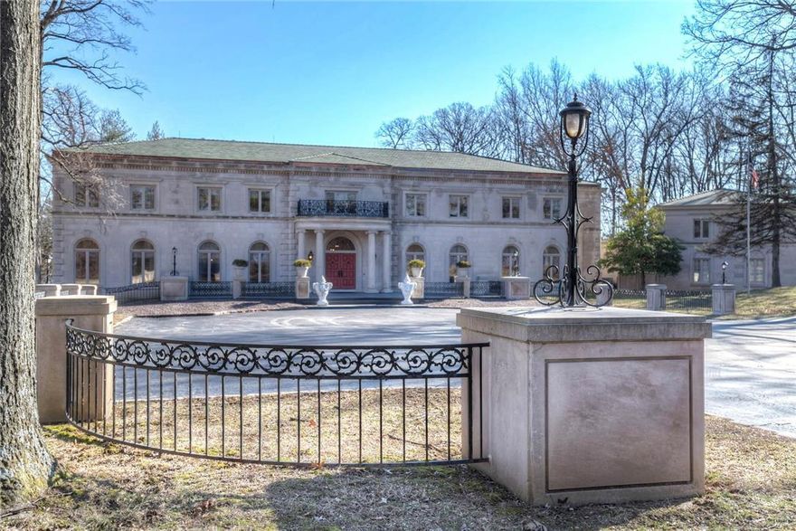 Spectacular property built in the tradition and scale of St. Louis' grand homes. The exterior is clad in limestone and the interior is finished with marble,imported fixtures and hardware, exceptional millwork, and plaster detailing.The library was August Chateau's and the home was customized to accomodate this significant piece of history. There is over 14,000 sq ft on the main and upper floors with six bedroom suites, four with sitting rooms. The all marble grand staircase is breathtaking. Features include a 45' x 26' Great Room w/ 30' cathedral ceilings,an elevator, 8 fireplaces, 11 bathrooms, a clover shaped pool,finished LL, carriage house apartment, 4 car garage, 5 plus acre property that is amazing in quality and finish. There is an additional 1 acre lot adjacent.  Lower level walks out to the pool and has 2 and one half baths and changing rooms.