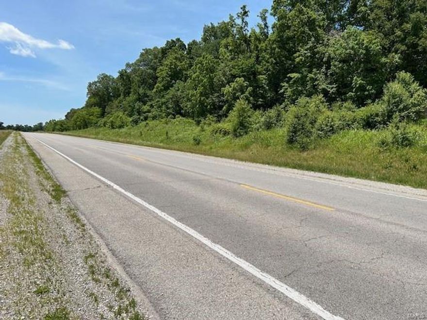 240+/- acres of wooded acres with access to county water. Possible residential/commercial development, recreation or estate home site. Final survey will be used to determine exact acreage.