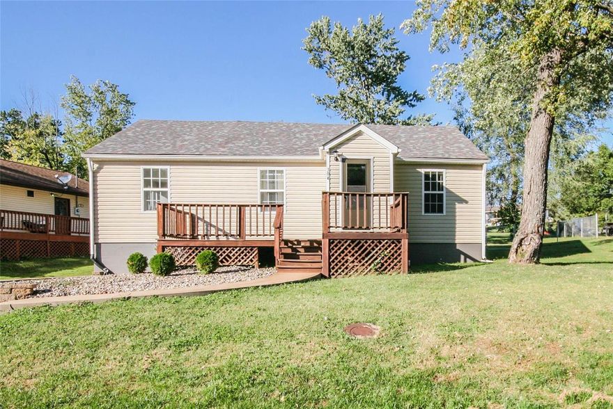 Low maintenance ranch features new carpet, laminate flooring and updates you've been wanting. An entry foyer leads to a living room with accent wall. The owner's suite has it's own full bathroom with shower and pedestal sink. The updated hall bath has tiled floor/walls and nice looking vanity. The eat-in kitchen has tasteful counters, dishwasher and stainless electric range, built-in microwave and refrigerator. Main floor laundry is right off of the back door! Newer architectural grade roof, easy vinyl insulated windows and vinyl siding. Enjoy the view of the neighborhood's trees and adjacent park from the front deck or sit on the back covered deck and enjoy peace and quiet in your newer fenced and spacious backyard.