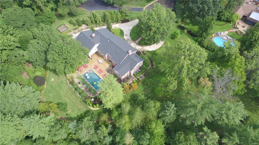 Magnificent very private 6 bed 4.3 bath estate on 1.7 acres in prestigious Bellerive Country Club Grounds. This home offers custom finishes at every turn.  Features include a living room with fireplace, a large family room, exercise room and a formal dining room complete with a butlers pantry. The kitchen is a chefs dream complete with high end appliances, granite counters, custom cabinets with an attached hearth room with a gas fireplace leading to a covered patio overlooking the gorgeous pool. This home offers a front and back staircase, LETS NOT FORGET THE ELEVATOR and laundry on all 3 floors!! Upstairs you will find the 20x26 master bedroom suite with spa like bath. the upstairs is complete with an additional 5 large bedrooms and 3 additional full baths and an abundance of closets. The backyard is a private gorgeous oasis with a resort setting and pool.  This home is the lifestyle you have been waiting for!! This home is fully handicap accessible. Some Accessible Features