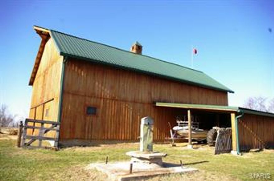 This is a unique opportunity to purchase a 122 acre Missouri River hilltop farm in Labadie. The land has long endless views from many different hilltop locations. The property has 65 acres of income producing agriculture land with the balance in heavy woods. There are excellent trails connecting the various fields that can be used for walking, biking, horse or 4 wheeler trails. The property includes one pond and has a 7 acre potential lake site, this farm has it all. The property has over 5 buildings. The main 60' x 30' barn that includes 7 horse stalls. A second large building would make an excellent barn for entertaining, it was formally used as an antique shop and has beautiful pine floors throughout. A stone building measuring 10 x 13 provides old world charm to this setting.  
Labadie Elementary and Washington High School.
Will Subdivide into 10-35 acre- preliminary subdivision plan upon request.