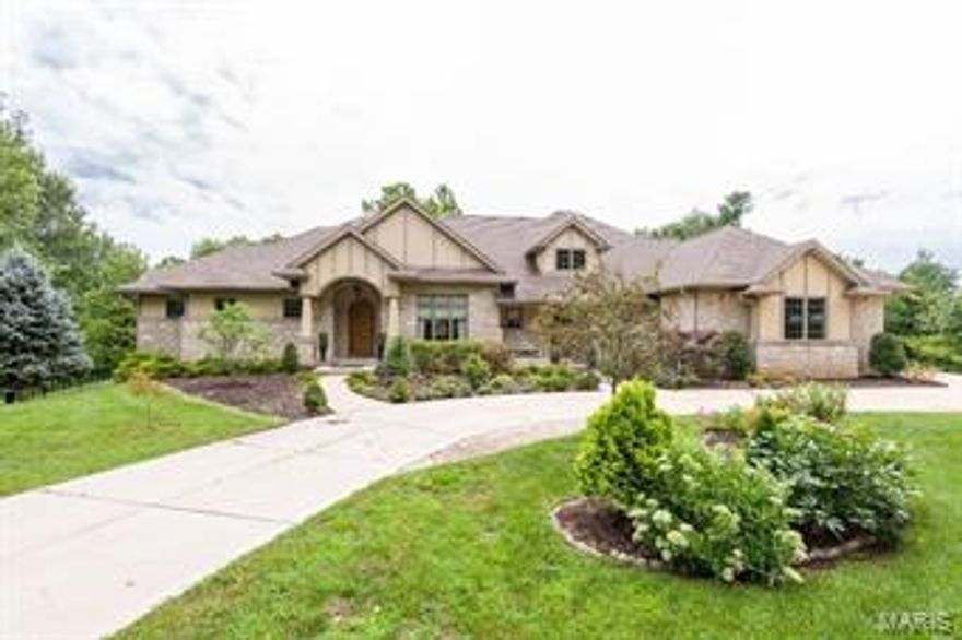 STUNNING HOME WITH 2 MASTERS ON MAIN. Beautiful architecture & fresh landscaping invite you to a 12’ tall entry w/ tile floors & a gas FP flanked w/ stone.  DR is currently being used as a sitting room w/ newer chandelier & recessed lighting. LR features dark HW floors, gas FP, stone hearth, & built in sconces; a for wonderful for entertaining. A wall of windows overlook the 1+acre private, fenced, lush backyard. An enormous eat in KIT features double sink, zub sero fridge, stunning two tone island w/ add’l storage, subway backsplash, double drawer dishwasher, 6 burner gas stove w/ hood, large pantry, dimmable lighting. A half bath & laundry complete the first level. The finished walk out LL features 3 add’l beds, each w/ walk in closet, neutral carpet & paint, full sized window w/ plantation shutters, overhead lighting & 10’ pour. Two additional full baths, another laundry w/ built in cabinetry & 2nd family room w/ HW floor make up the 4700+ sq ft of living space this home boasts.