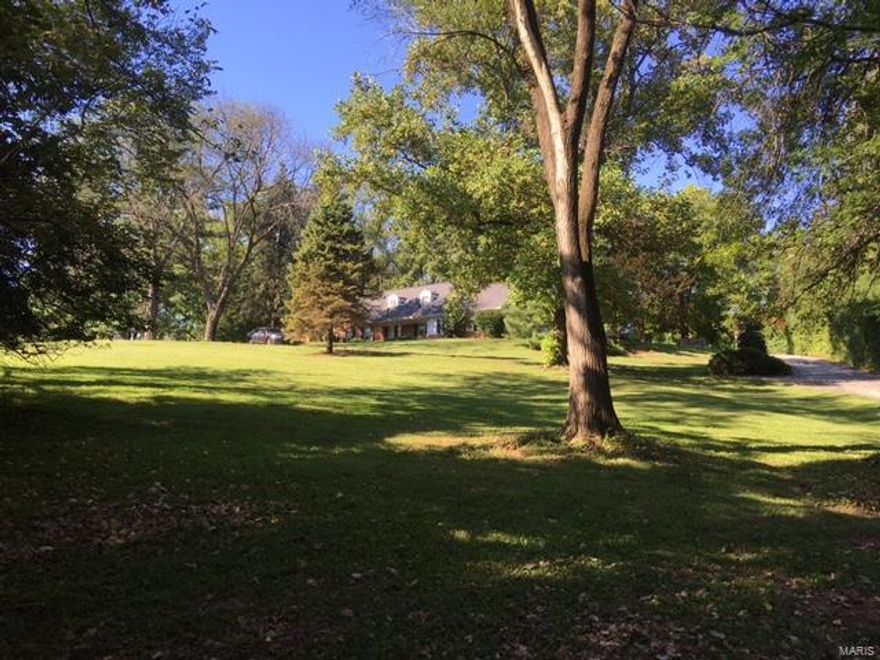 Beautiful 2.6 acre lot with mature trees.  Currently there is a home built in the 1960's by McBride and Sons totally over 4000 sq feet.  Home is being sold as is and does need work but has a lot of potential. Or possible best use might be to tear down home and build to suit.  Lot is large enough for 2 lots per Town and Country planning and zoning. The location is outstanding, within walking distance to St. Luke's Hospital and numerous homes in the immediate area of greater value. This is a wonderful opportunity for a builder, rehabber or buyer looking for a special project.  Must register before walking the property or viewing. Current owner is an estate and will require at least 24 hours to get a response.  There is an in ground pool, but estate has no knowledge and therefor there is no pool disclosure.  Seller will allow inspections but will do no work.