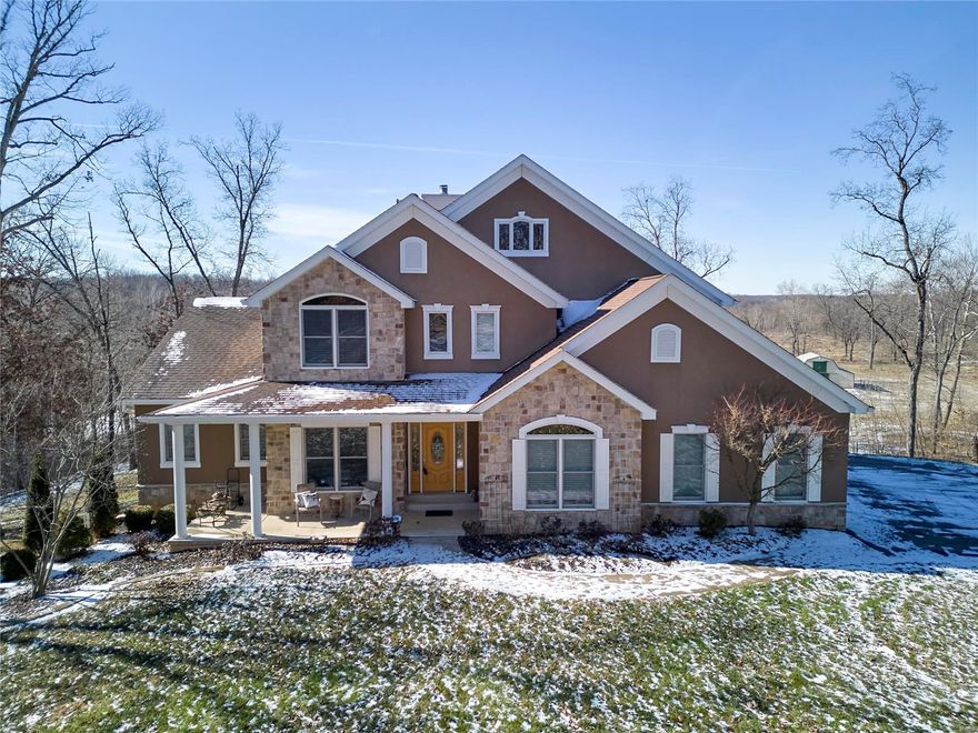 Spectacular custom 1.5 sty home w/5000+/- sqft of living space. Breathtaking view overlooks 18+ acres of countryside property, meandering creek, prof. landscaping & inground heated pool. Flawless details as you enter the foyer w/custom inlayed flooring & high quality finishes thru-out. Formal dining has coffered ceiling, Grt rm & brkfst rm have flr to ceiling windows. 17ft ceiling in great rm w/wood burning stone f/p, live edge shelving. Gourmet kitchen features maple glazed cabinets, Brazilian granite counter tops, custom designed ceramic flooring, stainless appliances w/5 burner gas cooktop, built in wall oven. Main flr mstr suite w/luxury bath & onyx Jacuzzi tub. Upstairs has spacious loft area, 3 bedrooms & full bath. LL W/O has 9 ft pour, 5th bedroom, full bath plus an additional sleeping room. Anderson windows thu-out cedar deck overlooking pool & grounds plus MORE!  Detached garage w/11 ft. ceiling, full electrical rv hookup. Additional Rooms: Mud Room