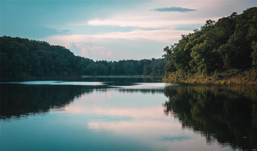 This continuous property consisting of 640 +/- acres features a large 35 +/- acre lake locally known as Diamond Lake. Located only 5 minutes from the Salem Missouri city limits- providing easy access to Springfield and St. Louis, Missouri. The habitat has been left undisturbed to ensure abundant wildlife such as whitetail deer, eagles and wild turkey. Both homes located on the property have spectacular views of the lake. The cabin was built in the late 1960's and features a large open concept living area with Anderson windows. The cabin has electric, drilled well & lagoon. Overlooking the lake, sits a 6 bedroom, 2 bathroom doublewide mobile home with water & 220 electric. The lake is stocked with many different fish species such as Large Mouth Bass, Blue Gill and Crappie just to name a few. The property is approximately 70% wooded with mature Oak, Walnut, and Hickory trees. 30% of the property is open with pastures. Come see it fast!