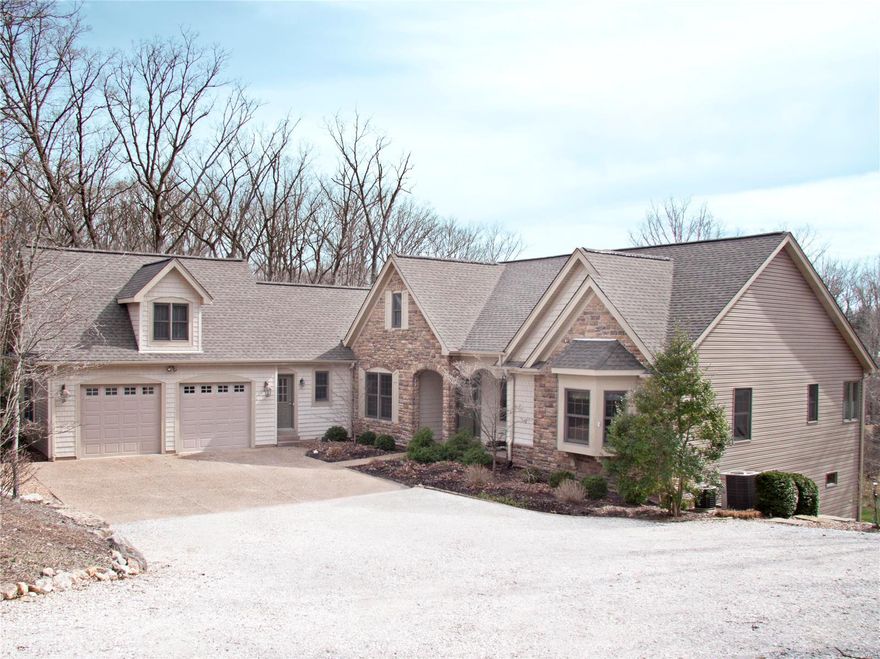 Spectacular lake views, a densely wooded lot with no visible neighbors, and a large, custom-built home provide an extraordinary setting for a weekend getaway or a year-round home. With over 3 acres on Lake Alpine, the only dock on this secluded cove is yours! Every room has lake or forest views. The main level's open plan has a great room with cathedral ceiling, fireplace, and a window wall. A gourmet kitchen includes granite counter tops, central island, and large dining area. The master bedroom has generous windows, walk-in closet, and large bathroom with corner Jacuzzi. The main floor includes a guest bedroom suite with full bath; separate dining room; laundry room; office; 3-season porch set into the woods; and a lake-view deck. The LL opens into an expansive recreation room with a mini-kitchen, bar and fire place. There are two more bedrooms, a full bath, and storage areas. The LL opens to another deck and covered outdoor dining/ sitting area.  Easy access to private lakeside dock Additional Rooms: Sun Room