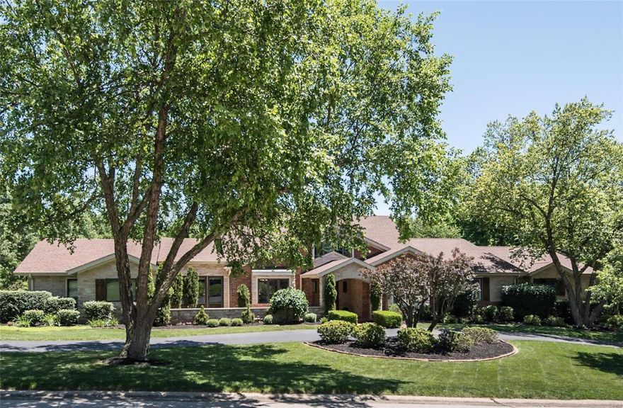 Spectacular brick & stone ranch home renovated & redesigned by Lewis Homes! Impressive travertine marble foyer highlighted by architectural columns leads to private study with wainscoting & custom built-ins & elegant dining room. Vaulted beamed ceilings, cast stone mantels & skylights add to the appeal of the stunning great room & step-down hearth room. Chef’s kitchen featuring glazed white cabinetry, granite countertops, commercial grade appliances & 2 center islands adjoins light-filled breakfast room with atrium door that walks out to terrace. Coffered sitting room opens to master bedroom suite with lavish marble bath with jetted tub, adjacent sitting room & 2 additional bedroom suites. Expansive Lower Level-ideal for entertaining-includes recreation room with brick fireplace, family room with entertainment center, gathering bar & solarium plus office, workout room & guest suite. Situated on a 1+ acre cul-de-sac lot with deck & patio surrounded by landscaped gardens with waterfall. Additional Rooms: Mud Room