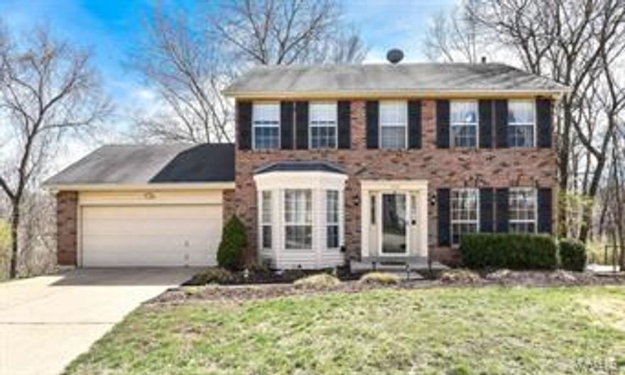 Charming 2 sty, great curb appeal, cul-de-sac location backing to woods. Crisp, light and bright. Updated kitchen, cherry cabinets, stainless appliances, silestone countertops & glass block backsplash. Great open flow to the family room featuring large bay window, woodburning fireplace, built-in bookcases. Master suite features luxury bath with jet tub, double sinks and his and her closet. Three more bedrooms and updated full bath complete this level. Lower level offers more living space. Large family room, bar and built-in desk area. Wonderful lower level patio, screen porch and large custom deck offers areas of entertaining from main and lower level. Great location, convenient to major highways. St.Louis county inspection completed.