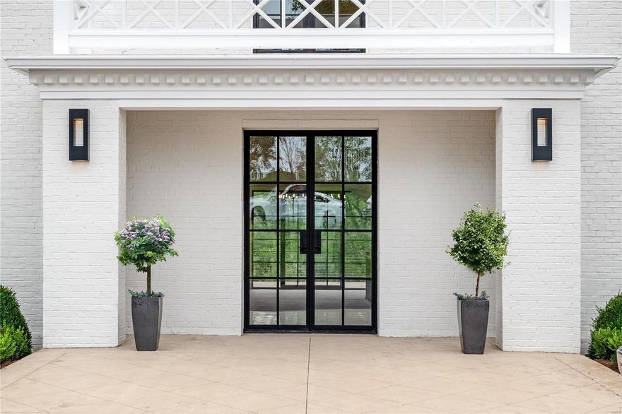 Welcome to this Hollywood Regency masterpiece that has undergone a meticulous renovation and expansion. Prepare to be enchanted as you enter this architecturally significant home that exudes modern elegance. Floor-to-ceiling windows invite the outdoors in, bathing the open floor plan in abundant natural light. A one-of-a-kind wine wall graces the entryway, while the breathtaking views overlook a lush canopy of trees. The sleek kitchen features a waterfall edge island that seamlessly connects to the dining room and hearth room, making it the ultimate space for entertaining guests. Host magnificent parties on the multiple terraces overlooking the pool. The main level primary suite is a luxurious retreat with its own fireplace, deck, custom closet cabinetry, and heated bathroom floors. Upstairs are four bedrooms, three full baths, and an inviting hangout area. Massive walk-out lower level includes an awe-inspiring glass-walled showroom garage. Truly a jaw-dropping residence.