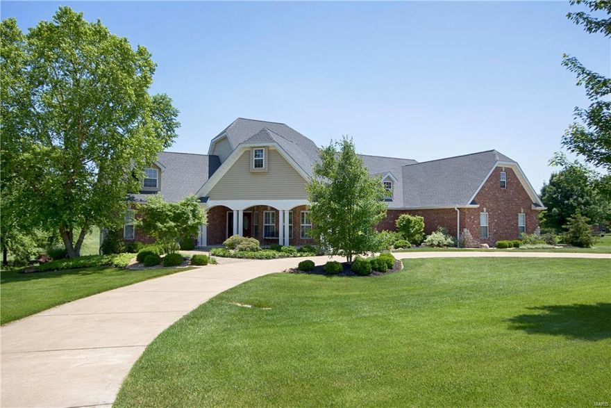 Quality & craftsmanship abounds in this gorgeous ranch nestled on a 3+ acre estate. With over $150,000 in upgrades, it is sure to impress from the remodeled kitchen & baths to the salt-water pool, 4 car attached & 2 car detached garage & more! Built for entertaining, this open floor plan boasts a formal dining room, flanked by columns, beautifully appointed great room w/gas fireplace, custom built-ins & reclaimed hickory hardwood floors, & a fantastic walk-out lower level complete w/a wet bar, media room, fifth bedroom & full bath. Gourmet kitchen offers custom staggered cabinetry w/molding, sprawling granite counters, high-end appliances, walk-in & a spacious breakfast room. The master suite offers a lavish retreat w/a walk-in closet, adjoining sitting room & remodeled ensuite boasting a whirlpool tub, shower w/dual shower heads & double sink vanity. 2 add'l main floor bedrooms share a Jack & Jill bath, 4th bedroom upstairs & 5th in the LL. You won't want to miss this gorgeous estate!