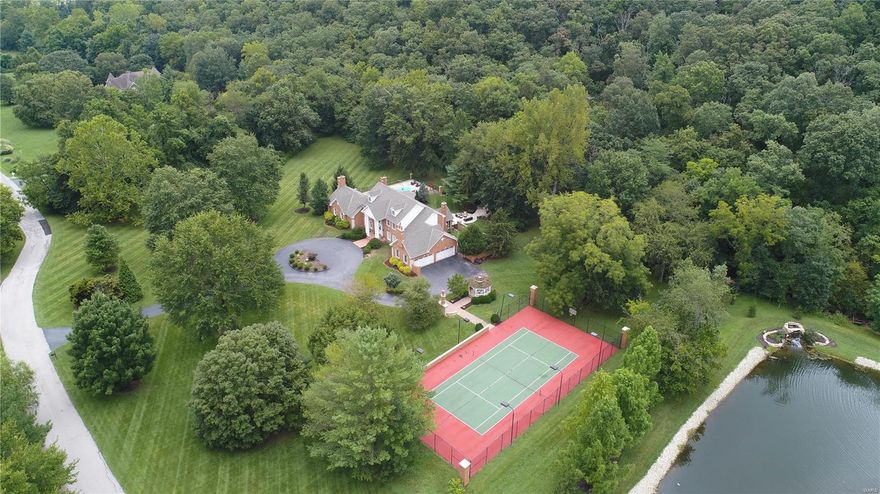 Rockwood School District and only 10 minutes from Wildwood Town Center! Designed to take full advantage of resort style living and no better place to get away from it all and quarantine. 4 sided brick home with a range of incredible features incorporated into a large estate that has been built for entertaining and seamless indoor/outdoor living. Almost 6 acres in gated community. Gorgeous walkways, salt water pool, 2 outdoor fireplaces, limestone patio. 2 story entry w/elegant staircase & exquisite light fixtures. Remodeled kitchen boasts 42 inch cabinets, granite countertops, island w/5 burner JennAir cook top & walk-in pantry. Amazing 4 season hearth room with one of 3 wood burning fireplaces & breathtaking outdoor views. FR is pristine w/built in book cases & shiplap wet bar. MBR vaulted ceilings, 2 walk-in-closets, Mstr. bath with open, wooded views. 3 additional BR, j/j bath & a private bath. Other features: 4 car carriage door garage, sprinkler system, sport court. Additional Rooms: Sun Room