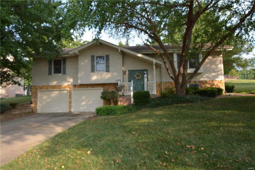 BEAUTIFUL POOL THAT'S READY TO SPLASH INTO SUMMER! Pride of ownership shines in this charming, clean & MOVE-IN-READY 3BR 2.5BTH split foyer w/1970+SF of living space just waiting for you to call it home! The exterior boasts great curb appeal featuring a vinyl front w/stone accents, lush landscaping & 2 car garage. Beautiful interior features an open floor plan including fresh modern paint tones throughout, a spacious living rm, elegant dining rm, bright eat-in kitchen w/custom cabinetry, new SS appliances, pantry, bkft rm & door to your private outdoor oasis w/large deck & 36' x 18' inground pool perfect for entertaining on hot summer days. The master suite offers a private full BTH. 2 add'l BR & full BTH complete the main. The finished LL features a large family rm w/wet bar, stone wood burning FP & half BTH. Other features include newHVAC, newer hot water heater & ALL LSL amenities. Great location w/easy access to major HWYs & top rated Wentzville Schools District. A MUST SEE!