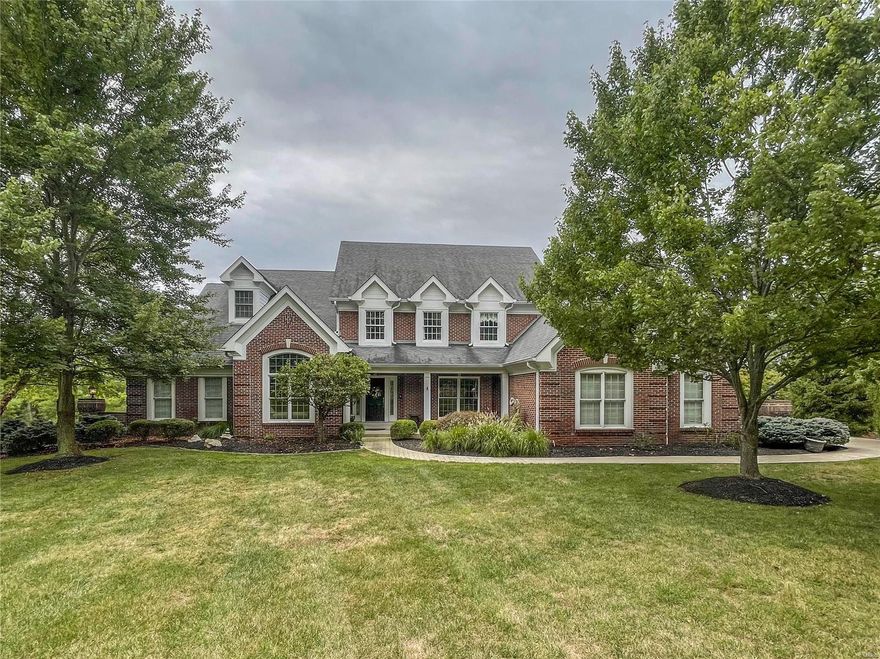 DeShetler built custom predominately brick home on one acre+ - inground pebbletec Baker pool, backing to woods, completely redone and very much today with color and design - 2-Story entry and great room - with library - custom millwork and shelving with french doors for an at home office - large dining room with wood floors in greatroom, kitchen hearth room and dining room - lush pale carpet in bedrooms and lower level - 5 bedrooms - with two additional rooms for craft work and another for exercise - separate rec room in ll - with wet bar and fireplace - actually 3 fireplaces - greatroom, hearthroom and recroom - top quality counters in white with marbeling of gray - impervious to stain - ample closet space - a t-staircase from entry and kitchen area for the family use - upper level is 3 large bedrooms and 2 baths - master has separate shower and free standing tub really large enough to relax in - newer driveway and front walk with custom concrete to appear as stone - Ample storage