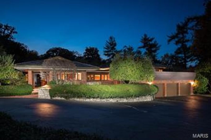 Simply stunning architecturally significant Ladue home designed by renowned architect Wesley Wedemeyer, in the tradition of Frank Lloyd Wright. The 5 bed, 8 bath home is the perfect backdrop for traditional or contemporary style. From the sophisticated entry foyer, with its slate floors and gallery of floor to ceiling windows, the open floor plan will impress. The house frames a dramatic central courtyard, with fountain and sculpture by William Severson. The formal dining room includes lovely built-in cabinets, while the spacious living room has a woodburning fireplace and adjoins the family room. The kitchen and breakfast room  include walk-in pantry and a nearby mudroom. The lovely master suite features his & her updated baths and walk-in closets. Three additional bedrooms and a large upper deck, perfect for entertaining. The lower level is part of an addition by William Bernoudy and includes large rec room, bedroom, study, bar, den and more! Three-car garage completes the property.