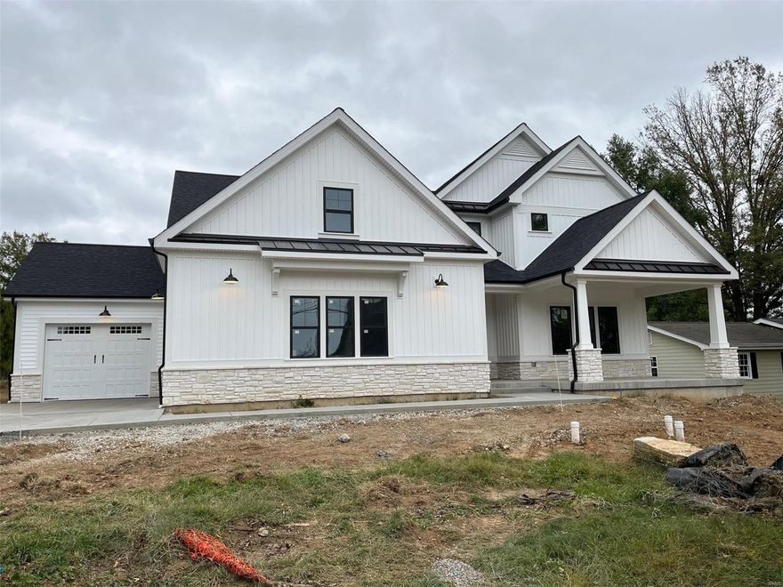 Spectacular modern farmhouse 1.5 story under construction by Boulevard Custom Homes.  This 5 bedroom, 4.5 bath, home features astounding finishes which include a 3-car side entry garage, hardwood flooring 1st floor and 2nd floor hall, gourmet kitchen with true custom cabinetry, large island and peninsula counter, crown molding, soft close drawers, 3 lazy susan's, pull-out spice rack, trash pullout, Quartz countertops, stainless steel appliances, under cabinet lighting, large walk-in pantry, built-in lockers, and impressive screened in rear porch.  12' high beamed ceiling in great room offers a fireplace, wine bar with wine cooler,  den/study with wainscot. Elegant master bath suite has coffer ceiling, large walk-in closet, adult height vanities, stand alone tub in master bath. Other amenities include wood front door,  wood treads on stairs, expansive 2nd floor bonus room, 2 full baths on 2nd floor, large bedrooms w/walk-in closets.  Finished lower level with rec room, bath, and bedroom Additional Rooms: Mud Room, Sun Room