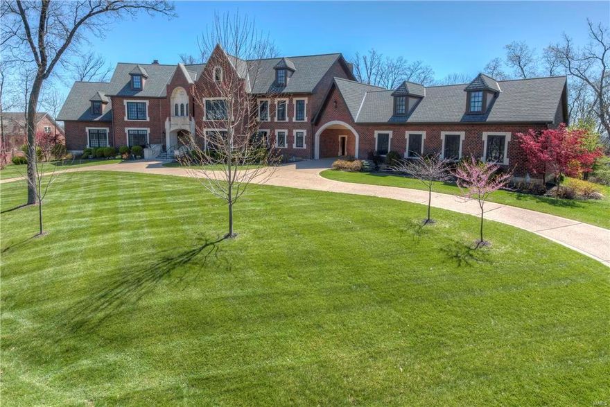 This home is situated on one of the most coveted streets in St. Charles County. Privately located in a 36 Hole Golf Community. Beautiful views from one of the Highest Points in the area, overlooking Chesterfield Valley, offering breath taking (360 degree) views from a Roof Top Observatory, irreplaceable!. Home is an all brick 1.5 story, with bedrooms and bathrooms galore, 11,000 square foot, & 3 acre lot. The sprawling flagstone patio, is surrounded by acres of mature oak and flowering timber. Architectural features, you would expect in a masterpiece like this, such as; a Sweeping Staircase, Lower Level Basketball Court and much more. Qualified Buyers must act quickly as this property won’t last long! Seller to offer a Home Warranty! Additional Rooms: Mud Room