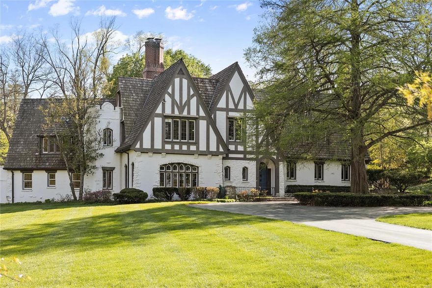 NEW LOOK AND NEW PRICE!!  You do not want to miss out on this fabulous transformation!  Back on the market with refinished hardwood floors and fresh paint throughout.  Built in 1930, this secluded English-Tudor estate is situated on 2.27 meticulously maintained acres, offering privacy in a premier location on Clermont Lane. Step inside the grand foyer with marble floors and beautiful French windows overlooking the patio and backyard.  Remarkable high ceilings, moldings throughout sunroom and living room, along with a step-down dining room with butler's pantry and breakfast room are located on the first floor. Kitchen features quaint breakfast area that joins to hearth room with stone fireplace, stained glass windows and wet bar. Upstairs features master bedroom suite with large dressing area, along with four additional bedrooms. Outstanding gardens, multiple outdoor terraces, and beautiful pool with patio area. 3-car garage. Additional Rooms: Sun Room