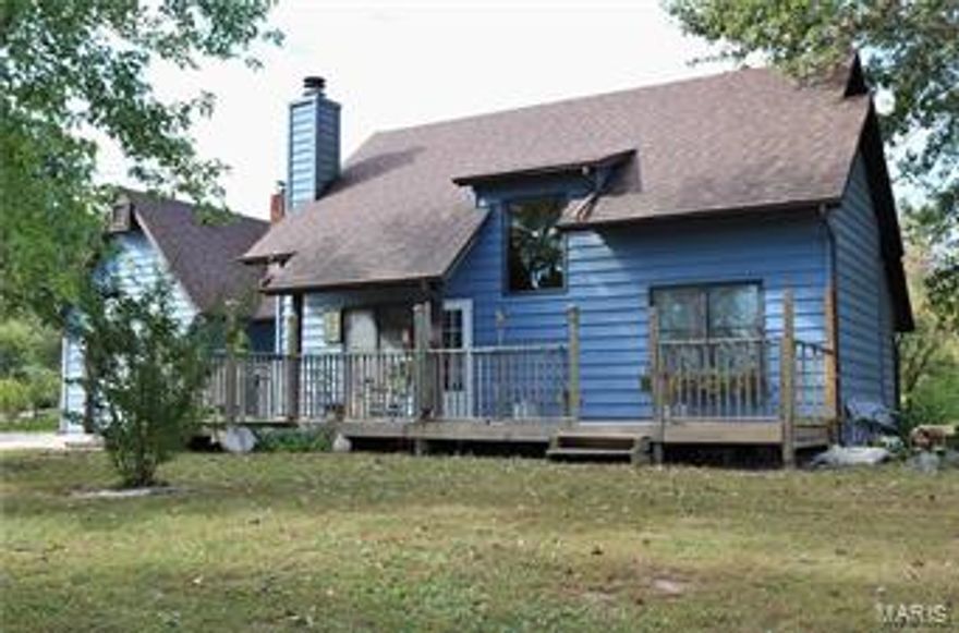 Situated on just over 14 acres this 3 bedroom 2.5 bathroom offers over 1,900 sq ft of living space. As you enter the front of the home you are greeted by the cathedral ceiling which opens up to the loft area on the second level. The main floor living room offers a wood burning fireplace. The open staircase leads you up to the second level of the home where you'll find a third bedroom and another full bathroom as well as a loft area which can be used for additional sleeping quarters or an office space. The partially finished lower level offers a walkout basement which has a large family room with a recreational area as well as a wet bar. The property offers four outbuildings one of which offers 5 horse stalls, another is being used as a stud barn, a chicken house and another outbuilding that could be used as a machine shop. There is a stocked pond to the rear of the property. This mini farm is just minutes from town and offers all the amenities that a small farm would need.