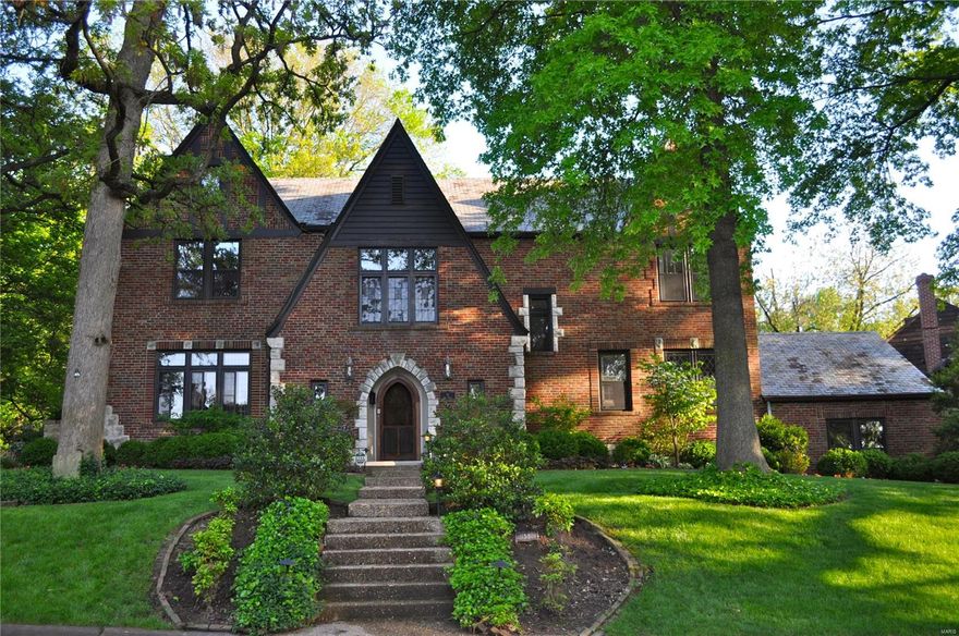 Impressive English Tudor located in coveted Lake Forest. Gracious foyer w/wrap around staircase. Stunning step down living room w/archway anteroom leading to lovely shaded brick patio. Huge dining room, great for entertaining, w/large bay window, overlooking expansive deck. Enormous eat-in kitchen. First floor bedroom/den w/adjoining bath, plus a pretty formal powder room off the entry. Access the 2nd floor by the grand front staircase or back stairs. Expansive master suite has large dressing room w/built-in closets and new master bath w/large shower w/double shower heads and seated bench. Three more large bedrooms and one bath complete the 2nd floor. Walk up 3rd floor awaits your finishes or relax in the finished lower level w/3 large rooms for kid and adult play plus a half bathroom. Stained/leaded glass windows, Terrazzo floors on main, hardwood on 2nd. Newly landscaped. Fabulous floor plan. Great home for entertaining and family living. 2-car rear entry garage. Clayton Schools!