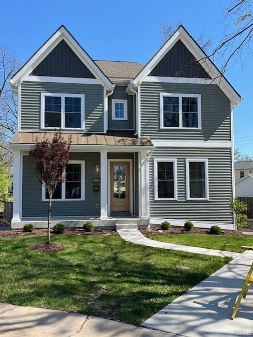 Walk to downtown Kirkwood from this new custom 2-story home built by Mahn Custom Homes in Kirkwood.  This 5 bedroom, 3.5 bath home features 10' first floor ceilings with 8' doors, 9' ceilings on 2nd floor, gas fireplace, Hardwood flooring on 1st floor, 2nd floor hall and master bedroom, custom millwork,  custom shaker cabinets, Quartz countertops with Elkay undermount sink, stainless steel appliances, ceramic tile kitchen backsplash, butler's pantry, cased out windows, recessed can lighting, luxurious master bath with stand alone tub and oversized shower, large walk in closet, 2nd floor laundry room.  Quality construction shown in 2 x 6 exterior walls, 6" gutters, mahogany wood front door, metal roof on front porch, stunning feature wall in dining room, exposed wood treads on stairs to 2nd floor and  finished lower level, which includes a rec room, bar, bedroom, full bath, and spray foam in all band boards, hi-efficiency water heater, zoned HVAC, patio and much more.