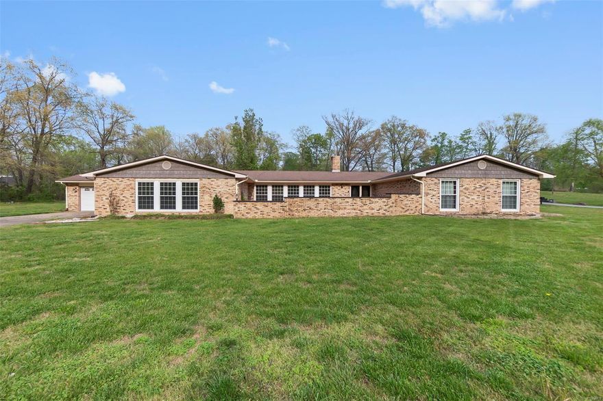 Discover the perfect blend of space, style, and serenity in this sprawling full-brick ranch, nestled on just over an acre of land. With a flexible open-concept layout, this home is designed for comfortable living and easy entertaining.

Step inside to find oversized rooms that offer endless potential.  The huge windows throughout the home bring in an abundance of natural light, creating a bright and inviting atmosphere in every room.

The rambling ranch design provides a seamless flow, while the brick exterior adds timeless curb appeal and lasting durability. Whether you're hosting a barbecue in the backyard, relaxing in your expansive living spaces, or dreaming up garden plans for your private lot—this home gives you the space to do it all. Additional Rooms: Sun Room