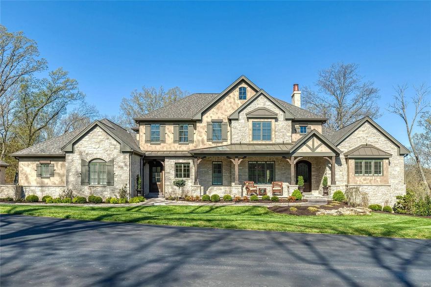 Spectacular Artisan Homes-built Estate home defined by timeless architecture & a sense of rustic elegance. Best-in-class design elements throughout including wide plank oak flooring, 10’ ceilings, elaborate millwork & designer lighting. Impressive marble foyer opens to elegant dining room & stunning great room with vaulted ceiling with timber beam trusses, stone fireplace & built-in bookcases. Exceptionally large kitchen with glazed cabinetry, granite countertops, commercial grade appliances & butler’s pantry adjoins breakfast room with wet bar & hearth room highlighted by floor-to-ceiling fireplace. Coffered master bedroom suite with lavish bath with shower spa offers a relaxing retreat. The 2nd floor extends the living quarters with 3 additional bedrooms, 1 with ensuite bath & 2 with Jack n’ Jill bath, plus bonus room. Outdoor living room features full-height fireplace, grilling station, hot tub & resort style pool with waterfall. Situated on a wooded 1.9-ac lot with 2 3-car garages. Additional Rooms: Mud Room