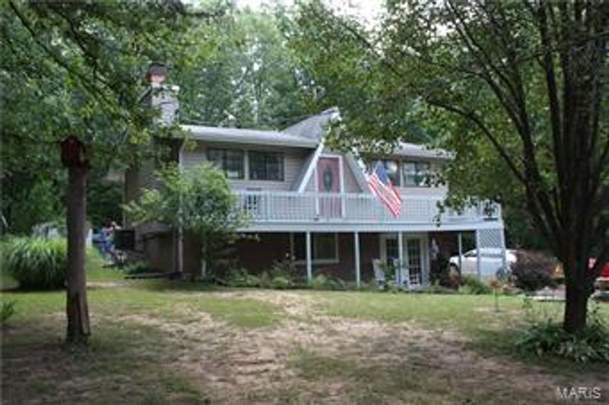 Cute cottage home located in Lake Timberline. The home is quaint and cute with a wood burning fireplace in the living room. 2 bedrooms on the main level. Basement is partially finished with a bedroom, bath and large laundry area. French doors to a patio. Home is on 2 lots that are Partially wooded and have lots of perennials !  Like to fish or boat? Don't settle for just a house. Have a home and a life of enjoyment! $89,000