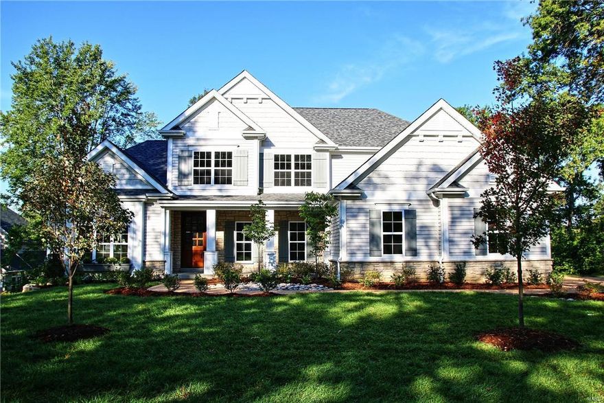 New custom 1.5 story home just completed in beautiful Harwood Hills subdivision.  Join numerous newer homes on this wonderful Des Peres street. This stunning 4 bedroom home features 9' first floor ceilings, job stained hardwood floors, custom millwork, built-in cubbies and 1st floor laundry.  Gourmet kitchen boasts custom built cabinets w/soft close drawers and doors, 42" wall cabinets with crown molding and light rail, backsplash, stainless steel appliances, double ovens, granite countertops, two large islands, and walk-in pantry.  Custom built cabinets and bookcases flank the gas fireplace in the family room which also features a built-in butlers pantry and wainscot trim.  Luxurious master suite has coffered ceiling, walk-in closet,  spacious master bath with granite countertops, wonderful large shower, and ceramic tile floors. Second floor has wood in hallway, spacious bonus room, hall bath includes double bowl granite countertops, ceramic tile floors and oil rubbed bronze faucets.