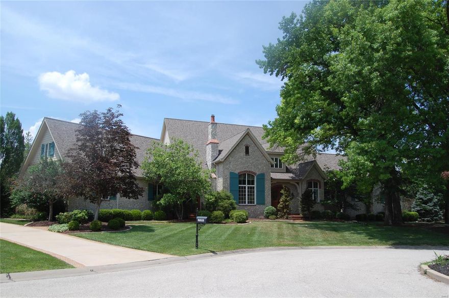 Make an offer! Nestled in a private cul-de-sac of only four executive residences, this French Normandy home is filled with fine design choices and true custom construction. The exterior is tumbled stone, a theme that carries throughout the home. The random width flooring is constructed in country themed knotty pine which has been recently refinished. Vaulted ceilings and open floor plan are elegant key notes. Chef kitchen boasts oversize island and breakfast room, opening to a beamed Hearth Room. Spacious living and dining rooms. Main level Master wing includes an office and provides abundant closet space filled in natural light. Three suites on second level. Walkout lower level has full wine cellar, billiard room, potential sleeping area, living room and gameroom. Outdoor entertainment is thoughtfully designed around the pool and spa, with outdoor kitchen and deck. New roof and HVAC. Make your personalized cosmetic changes to complete. Oversize three car garage.