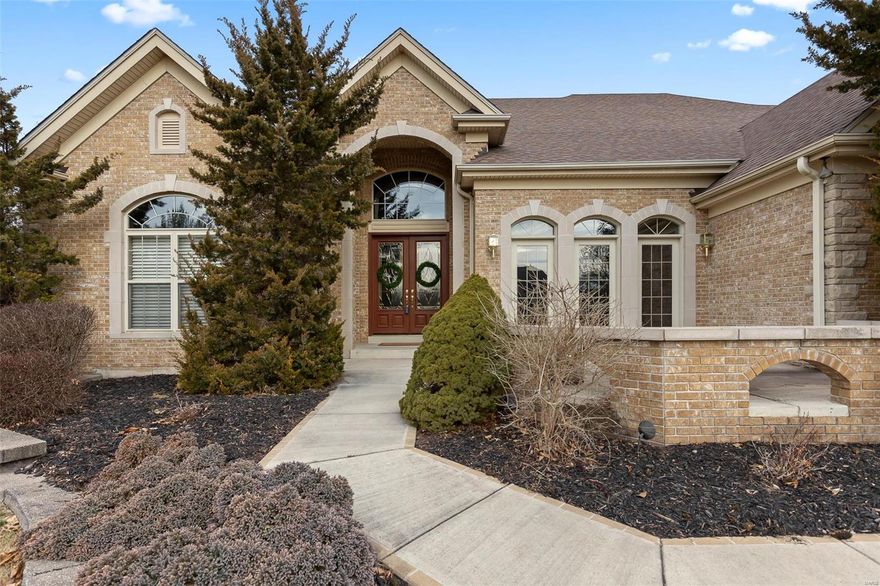 Welcome Home! Impeccably maintained expansive custom home on private street overlooking Greenbriar Country Club is perfect for entertaining.  Gorgeous entry foyer with grand staircase greets you upon entering.  Completely open floor plan offers enormous kitchen with maple floors, custom cabinets, Silestone counters, double oven, oversize built in KitchenAid fridge, wine fridge, and walk in pantry. Both Great room and Hearth Room have built in bookcases & gas fireplace. Enjoy sunny days in 4 season room with split HVAC system. Main floor master suite with walk in closets, whirlpool tub, separate shower & double vanities. Additional bedroom/office on main floor. 2 ensuite bedrooms upstairs with loft area.  Opportunity awaits in partially finished lower level...plenty of space to add bedrooms.  Situated on a 1.25 wooded acre lot in this desirable location. 4 Car garage. Close to shopping, highway access, and dining.