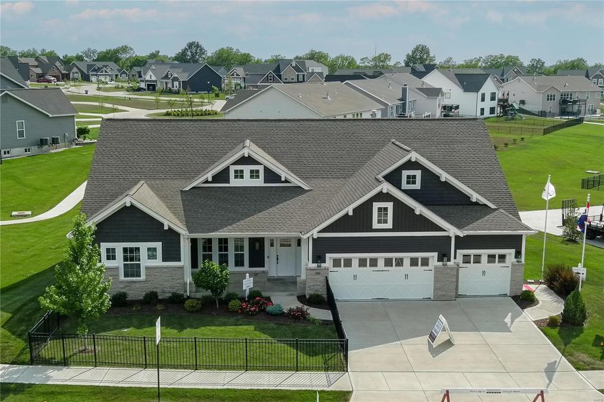 This beautiful 4 bedroom, 3.5 bath ranch display home has a split bedroom design, with private entrance to the Owner’s Suite, Jack and Jill bath, and a home office space.  The Owner’s Bath has an oversized shower with gorgeous tile, brushed gold fixtures, and “U” by Moen shower system.  The Great Room features beautiful stone gas fireplace with wrap around bookshelves, 11’ ceiling with transom windows looking out to the spacious covered patio.  A cook’s dream, you will find Bosch appliances including gas cooktop, built in oven/microwave, refrigerator, and dishwasher. If you love entertaining, you won’t believe the huge kitchen island at approximately 9’ long.  The Butler’s Pantry is complete with wine storage and wine cooler.  The family foyer provides a desk, cubbies, and an oversized hall closet. The lower level has approximately 1200 sq ft of finish that includes, rec room, wet bar, large bedroom, and ¾ bath.  There is still plenty of space for additional finish and storage.