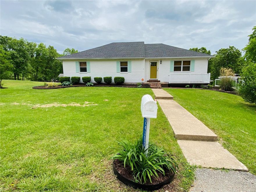 This completely updated 4 bed 3 full bath home is located 10 mins from the West gate of Ft. Leonard Wood & is ideally situated at the end of a quiet street. You'll love the park-like setting on a nearly 1-acre lot, the added front porch, & the back deck & all seasons patio space with a fire pit. The custom kitchen offers stainless steel appliances, a farm sink, granite countertops, a beautiful tile backsplash, a custom island, solid wood cabinets & pantry. Also on the main level is a bright, open-concept living/dining space, a spacious owner's suite with 1 walk-in closet, an additional closet, & an updated master bath with dual sinks & large tiled shower. Downstairs is a finished walkout basement with a wood-burning fireplace, a full bath, a large laundry room, & a large bonus room with a walk-in closet. Updates include a new roof, concrete siding, engineered hardwood, LVP, tile & carpet, bright paint, light fixtures & ceiling fans. CALL TODAY for your showing!