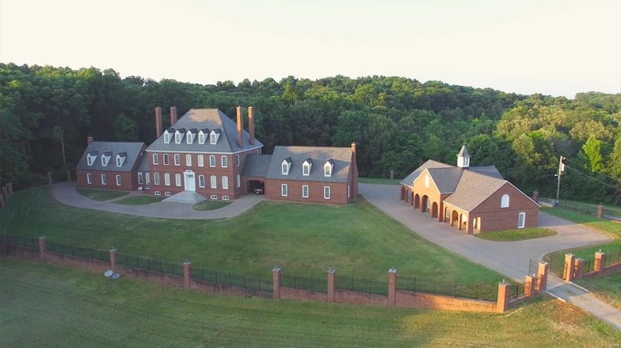 A private retreat on 94.7 acres awaits you, a few short minutes from the regional airport and interstate. This extraordinary property features a stunning reproduction of a colonial Williamsburg mansion, a caretaker house, pond, woods, and multiple barns and outbuildings. The carriage house contains the mechanical systems, and a 110 foot tunnel pipes heat and water to the house, preserving the feel of history. The home is a masterpiece of brick, Vermont slate and wood work. 1st and 2nd level ceilings are 12’ with 8’ custom solid wood doors; 3rd floor ceilings are 10’ with 7’ doors. The mansion has 9 bedrooms, 7 baths, 6 decorative fireplaces w/25’ chimneys, gourmet kitchen and butler’s pantry, indoor elevator and indoor pool room. The charming caretaker house at the gate is a 3 bedroom, 2 bath picture-book home. All of this is nestled in breathtaking countryside, with gently rolling hills. Schedule your private showing today, and find your place in history.