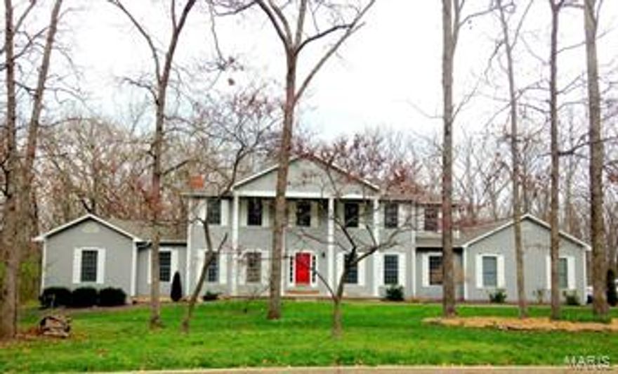 THIS CLASSIC OAK KNOLL HOME IS A GEM IN A BEAUTIFUL SETTING.  All the big, lovely windows in this perfectly manicured home look out onto a large, parklike, gently wooded lot.  The house features two elegant master bedroom suites - one on the main floor and one on the upper level.  Each serene suite has it's own generous sitting area, whirlpool tub, separate shower, walk-in closet, and picturesque views.  The handsome family room has a brick hearth, built-in bookcases, an expansive bay window,  and wet bar.  The ample eat-in kitchen invites cooking and entertaining with generous counters, large island, two pantries, glass doors onto the large private deck, and an adjacent formal dining room.  The walk-out basement has room for gathering, relaxing, and activities.  Walking through the home you'll notice the roomy bedrooms, sun-filled main floor laundry, solid wood doors, and pleasant upstairs landing.  The roof was new in 2013, and the HVAC in 2009.