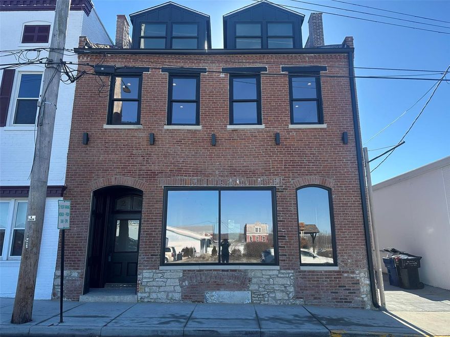 Prime commercial space available for lease! This first-floor unit boasts a stunning large window display, perfect for showcasing your business. Featuring exposed brick, soaring 15’ ceilings, and beautiful hardwood floors, this space blends character with modern functionality. Includes an open retail space, office/storage area and a bathroom for added convenience. You will also have access to the lower level for additional storage. Located in the proposed Main Street District, a high-visibility, walkable area near downtown, this C-3 zoned property is ideal for retail, office, or creative ventures. A fantastic opportunity to establish or expand your business in a thriving location! Tenant to pay all utilities. Credit and background checks are required and at sole discretion of the owners. Location: City, Downtown, High Traffic