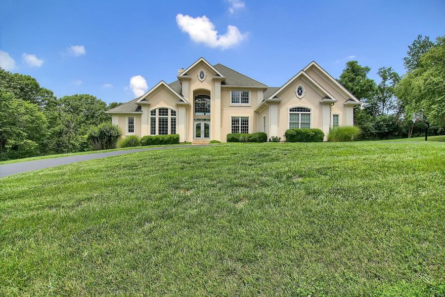 NOT ON MAIN ROAD-Take the Private Lane to an Awesome 3 ACRE SETTING!  Custom 1 1/2 Story Home with So Much to Offer! Elegant. Private Setting yet minutes to Suburbia. 2 Story Entry Opens to Spacious 2 Story Great Room with Fireplace & Lots of Windows for Natural Light.  Beautiful Kitchen is Open to Great Room & Breakfast Room & Vaulted Hearth Room-Perfect for Relaxing & For Entertaining! Breakfast Room Opens to Large Covered Outdoor Patio w/Fireplace-Perfect Outdoor Entertainment Space!  Main Floor Master Suite with Coffered Ceiling and Huge Luxury Bath with Double Walk in Closets. Upstairs features Loft Area overlooking Great Room + 3 more Bedrooms & 2 More Baths & Lots of Walk in Closets. HUGE Finished Lower Level with Recreation Room + Multiple Bonus Rooms & Full Bath.  Outside is great for entertaining  w/Large Covered Patio, Inground Pool and So Much Green Space for Play & Enjoying Nature. 3 Car Garage..NEW ROOF-FALL, 2019..Lots of Fresh Paint & New Carpet..Tasteful Decor & More!