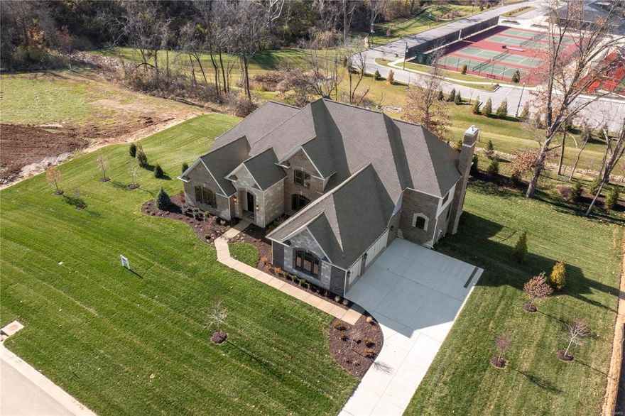 This new luxury custom home by Simon Homes is MOVE IN READY. Stonechase is a luxury gated community of 9 homesites in Town & County. Only 2 lots remain. Built by a very experienced and well respected builder, Simon Homes. This home was just completed in November.  The Chesapeake is a 1.5 story and offers a first floor master suite, open kitchen and hearth room floor plan, 2 fireplaces, hardwood flooring, custom beamed great room ceiling, Cambria counter tops, and two half baths on main level. Upper floor includes 3 bedrooms and 3 baths plus a bonus room. One acre homesite with a walkout lower level with a nice usable rear yard. Brick and stone exterior with approximately 5300 square feet of finished space. This luxury home includes many custom features!  Interior finish selections have been made by professional designer for your review.