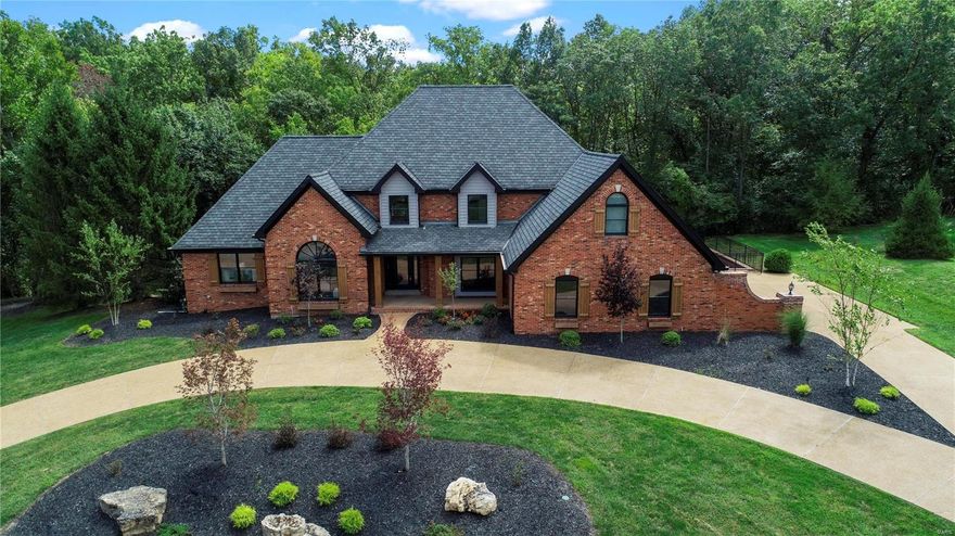 Magnificent T&C Estate has been completely remodeled with the finest luxury details! Enter into stunning 2-story entry foyer with spectacular reclaimed metal railing by celeb artist, Russel Gehrke. Hand scraped hardwood floors lead you into Living Room with sky-high vaulted ceiling & fireplace. Opens into 4 season Sunroom with floor-to-ceiling windows, perfect to enjoy views of the wooded backyard. The immaculate Kitchen has top-of-the-line finishes including pristine quartz countertops, double ovens, breakfast bar & more! Main floor Master Suite is a perfect retreat with walk-in closet, sitting area & bathroom oasis w/ herringbone floor, dual vanities, walk-in shower & soaking tub. Bedroom ensuite and Jack & Jill bed upstairs. Walkout Basement is the perfect place to entertain with a bar, rec area, 2 full baths & more! Enjoy outdoor Kitchen and fire pit this fall, with private basketball court & fountain. Complete with 3-car garage. Backs to Queeny Park! Additional Rooms: Sun Room