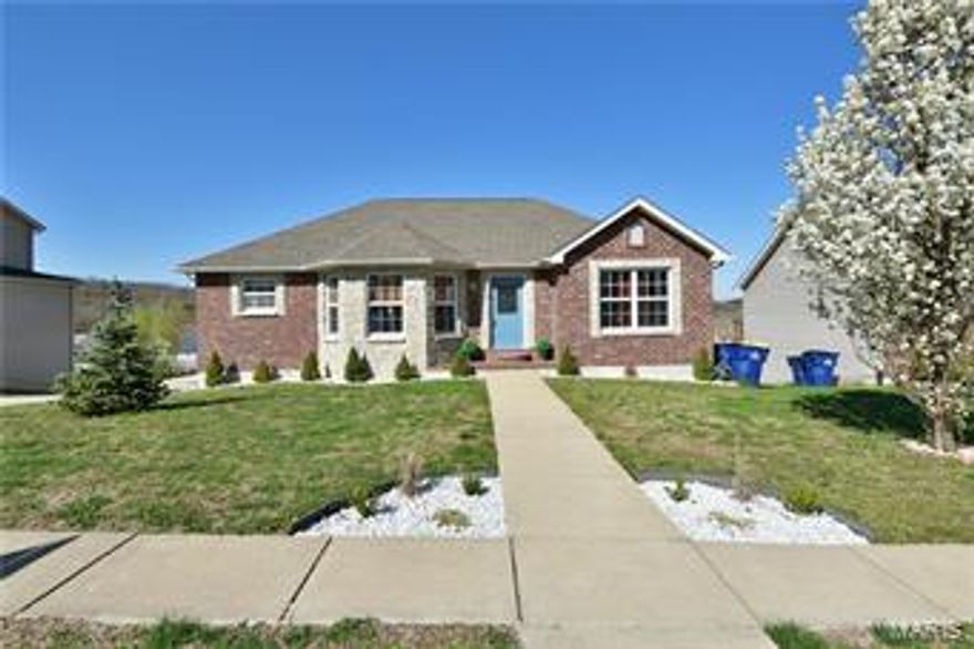 Prepare to fall in love with this inviting brick/stone front 3 bed/3 bath ranch residence. The open & flowing floorplan greets you with handsome hardwood flooring & a soaring cathedral ceiling complementing the great room & dining room while the adjacent eat-in kitchen features gorgeous custom cabinetry with crown moulding & a walk-in pantry. Ultra-convenient main floor laundry. Retire in comfort to the spacious main floor master suite with his & hers closets (1 is a walk-in) + a private full bathroom. The finished walk-out/look-out lower level adds tremendously to your functional space with an adjacent family/recreation & sitting rooms + the 3rd full bathroom. Enjoy the refreshing outdoors with the elevated deck + the patio & privacy fenced yard. Easy access rear-entry garage with additional off-street parking makes coming home a breeze. Treat yourself with an Appointment to view this one Today!