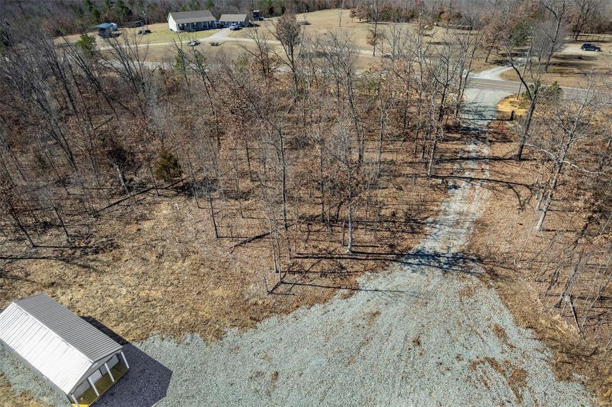 OPPORTUNITY is knocking for this 79.34+/-  BEAUTIFUL wooded acres ! This property offers a area cleared w/ a large rocked parking lot & a great place to put campers on this large area you will find a 14x36 Cardinal building w/ a roll up door to put your utility vehicles. And with the front having a sitting porch & a service door there is a blank canvas for you to build out your living quarters for weekend getaways . This is a great property w/ abundant signs of deer & turkey all over the property there is also a trail system throughout the perimeter of the property & also a large area that has been cleared for a food plot. If you want to build a home/cabin on here there is several spots that would make great home sites. The castor river is not far from the property to go enjoy fishing. But wait there's more adjoining  this property to the east & south is 374+/- acres of Mark Twain National Forest which expands your hunting & hiking opportunities. Don't miss out on this BEAUTIFUL LAND.