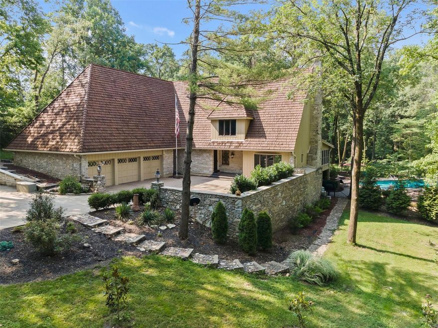 Welcome to this enchanting 2 story home nestled on a private 1.66 acre lot with a fabulous inground salt water pool! You will feel like you are in the middle of nowhere, yet you are only minutes from everything! This custom home is situated down a winding lit drive and the charm is seen immediately with the stacked stone exterior and newer, recently stained cedar shake roof. Impressed by the outside? Wait until you see the inside! The chef's kitchen features granite countertops, ss appliances, floor to ceiling pantry cabinets and a breakfast room that overlooks the peaceful backyard. Off the kitchen double doors lead to the formal dining room. The living area is perfect for entertaining with a wet bar, large stone fireplace and french doors that lead to the sunroom overlooking the inground pool. Upstairs updates are found throughout with newer hardwood floors, updated bathrooms and an additional laundry room! Enjoy additional living space in the finished walkout lower level. Additional Rooms: Mud Room